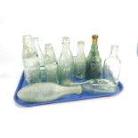 A collection of Bourne Waters bottles, including R M Mills and Company, Smith & Co Bourne Waters,