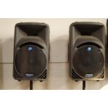 A pair of Mackie SRM 450 Active Sound reinforcement monitor system speakers, upon Stagg speaker