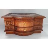 An inlaid and relief carved mahogany jewellery box, 38cm wide.