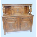 A Weather Furniture linenfold style oak court cupboard, having central cupboard with relief