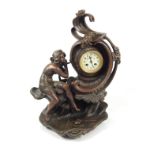 An early 20thC Continental spelter figural mantel clock, depicting lady with cresting wave, the dial