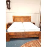 A mixed hardwood Superking bed, with twin single Majesty mattresses, together with two matching