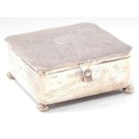 A George V silver jewel casket, of square shaped design, the hinged lid with engine turned and