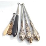 A collection of silver handled button hooks, and others. (6)