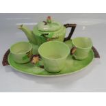 A Carltonware leaf pattern tea service for one, comprising teapot, cup, milk jug, sugar bowl and
