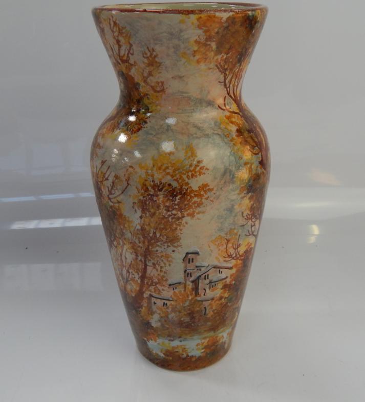 A Studio Pottery vase, with indistinct signature and woodland scene, 28cm high.