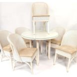 A Lloyd Loom of Spalding glass topped circular table, with six upholstered seat chairs, (7).