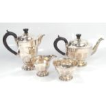 A George VI silver four piece tea set, of plain circular semi fluted design, Sheffield 1938, 33oz