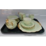 A Coalport part tea service, comprising cups, saucers, side plates and sugar bowl.