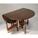 A reproduction oak gateleg table and six ladderback chairs. The upholstery in this lot does not