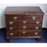 A Georgian mahogany chest, having two short drawers over three long drawers with brass batwing