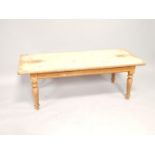 A pine scrub coffee table, with turned legs, 140cm wide.