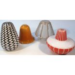 Various mid-20thC retro and other light shades, to include a black and white geometric example,