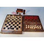 An Edwardian games compendium, in the form of two books with an exterior chess board hinging to