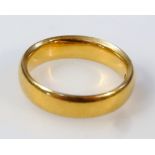 A 22ct gold circular wedding band, size J-K,  6g.