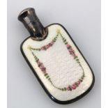 An early 20thC enamel and white perfume bottle, the shouldered body raised with garlands of