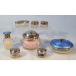 Various silver and enamel dressing table pieces, to include a glass jar with silver and blue