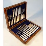 An early 20thC silver plated and mother of pearl canteen, of entree knives and forks, settings for