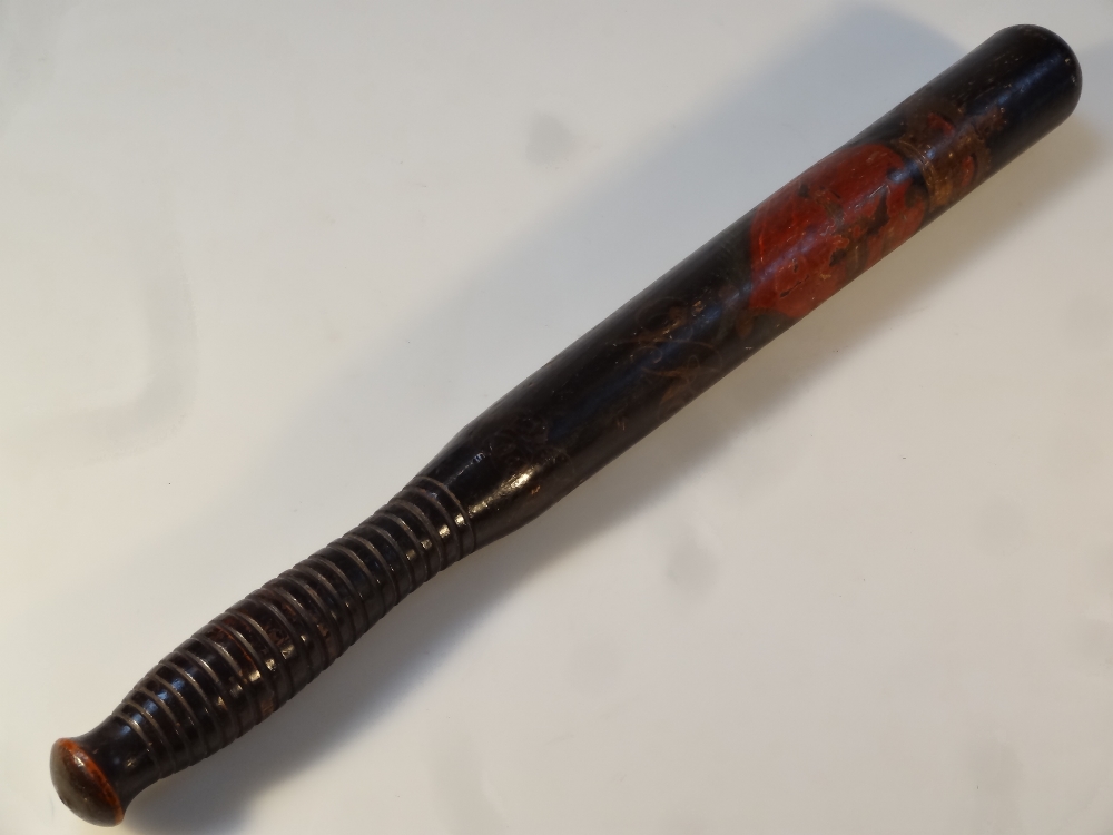 A Victorian ebonised oak truncheon, the moulded handle painted with a crown and heart with the