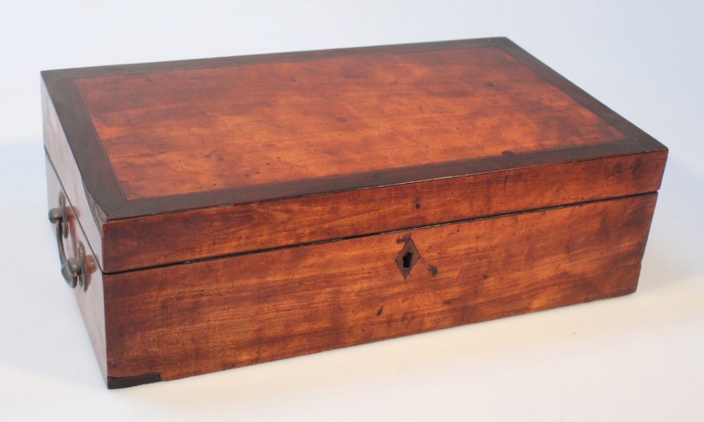 A 19thC satinwood writing slope, the rectangular top with a wide crossbanding hinging to reveal a