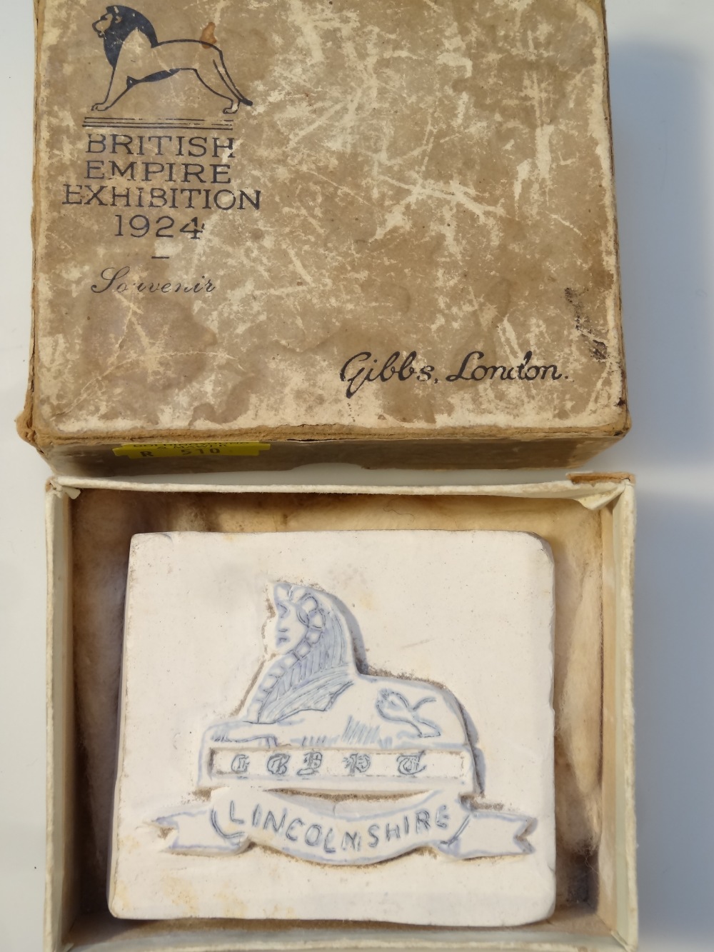 A Lincolnshire regimental cap badge, 7cm high, another, a Lincolnshire sphinx plaster cast block, - Image 2 of 2