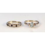 Two ladies' dress rings, to include half eternity set with blue and white stones, on a plain shank