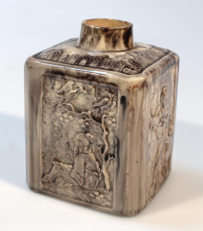 An 18thC Staffordshire Whieldon type tortoiseshell pottery tea caddy, the square body with a moulded