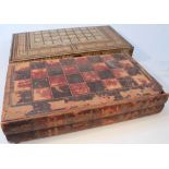 A late 19thC/early 20thC Damascus type sandalwood rosewood and parquetry backgammon board, the