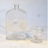 A glass decanter, the shouldered body decorated with flowers, centred by the initial A, 21cm high,