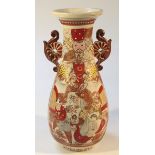 A Meiji period Japanese pottery vase, decorated with many figures in a satsuma Kutani palette,