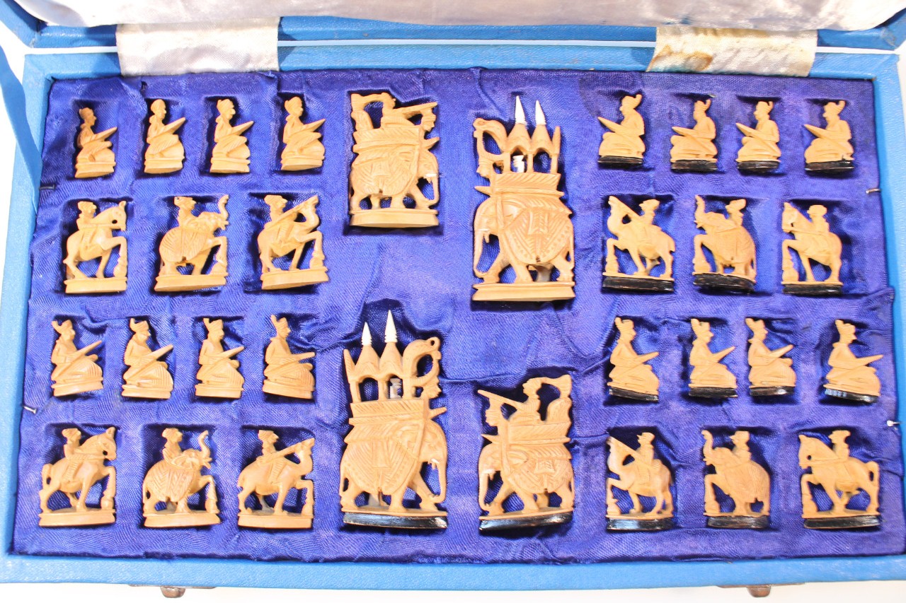 An Indian sandalwood chess set, the pieces carved as figures on the backs of elephants, camels and - Image 2 of 4