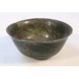 A Chinese olive green jade bowl, of plain circular form on circular foot, unmarked, 10.5cm dia. (