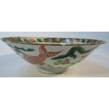 A Chinese porcelain Ming period bowl, polychrome decorated and centred with a fish in orange, with a