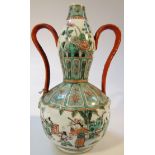 A Chinese porcelain Ming gourd vase, with shaped handles, polychrome decorated with flowers and