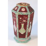 A Chinese porcelain and enamel vase, the hexagonal body painted with lotus scrolls and flower