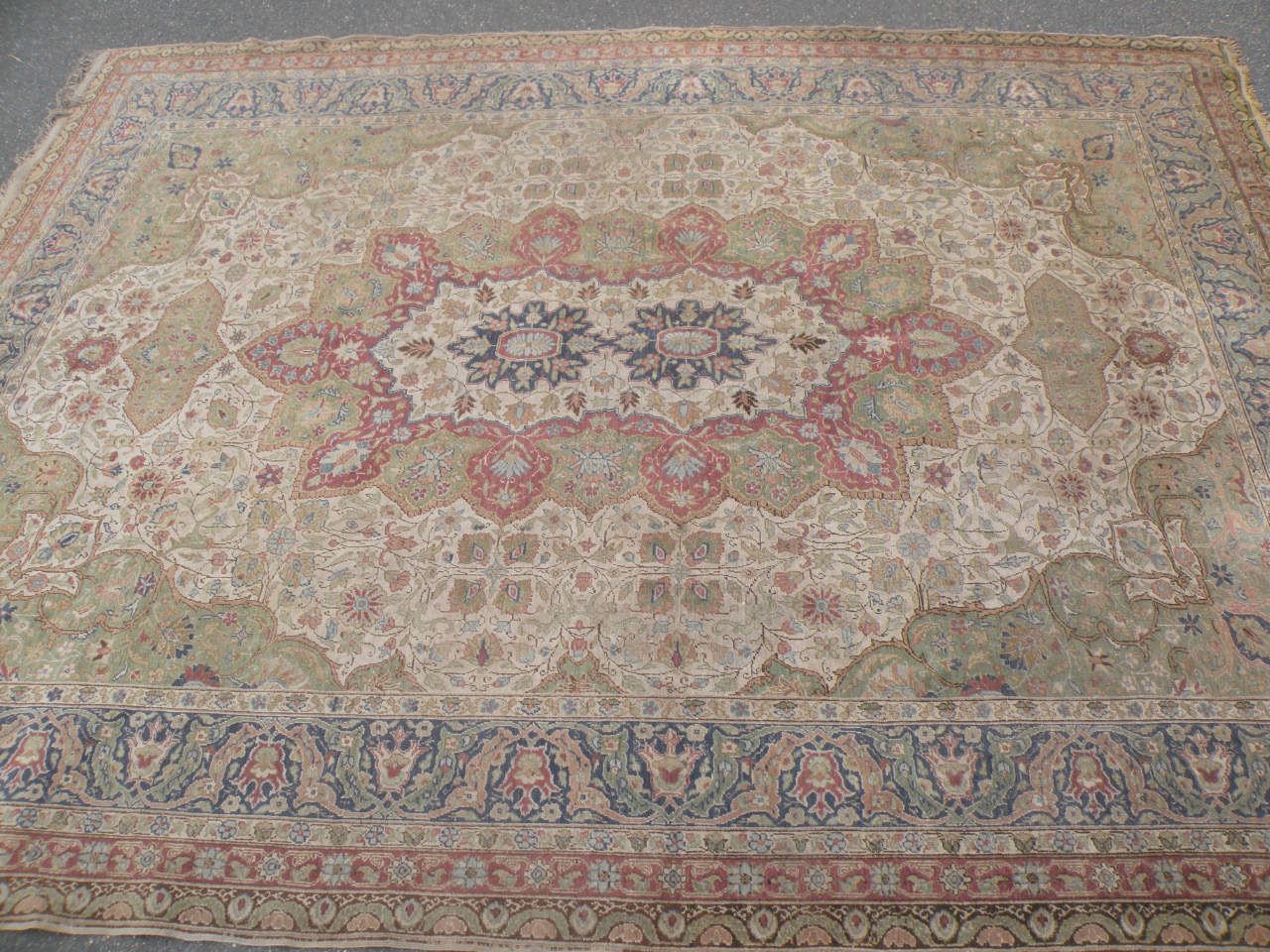 A 19thC Turkish Kayseri rug, hand woven, set with a geometric pattern in cream, blue and red