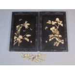 A pair of 19thC ebonised and ivory panels, raised with various foliage in an outer floral and