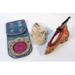 A Chinese silk child's shoe, the heeled material back and pink silk body gilt thread highlights