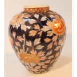 A late Meiji period Japanese Imari vase, the shouldered circular body profusely decorated with