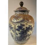 A Chinese blue and white Ming period jar and cover, the domed lid with orb knop decorated with