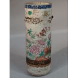 A late 19thC Chinese pottery umbrella stand, polychrome decorated with flowers, predominately in