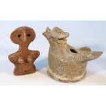 An African tribal style pottery figure of a hen, possibly a lamp with hole to lid and mouth, on a