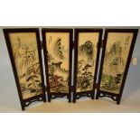 A Japanese hardwood miniature four sectional screen, set with various hand painted panels with