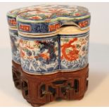A Chinese porcelain jar and cover, polychrome decorated with dragons, predominantly in blue,