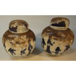 A pair of 18thC Chinese Yong Zheng blue and white jars and covers, each bulbous shouldered body,
