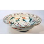 A Chinese porcelain Ming style bowl, polychrome decorated and centred by a lady and child in an