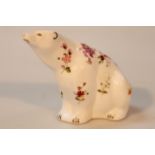 A Royal Crown Derby poises paperweight, in the form of a bear, gilt stopper beneath, 12cm high. (