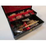 A black leatherette jewel box, and contents of costume jewellery.