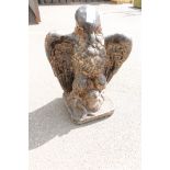 A gate finial formed as an eagle, with wings outstretched, probably hard baked earthenware,