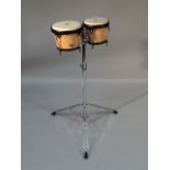 A modern set of CP LP bongo drums, in light wood on a chrome metal tripod stand, 104cm high.